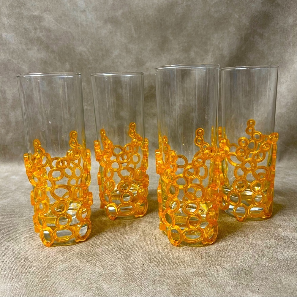 Set of 4 Koziol drinks glasses with orange bubble glass holders
